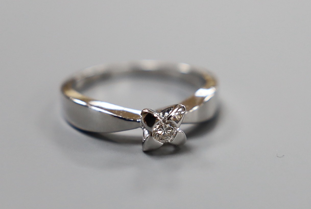 A modern platinum and single stone diamond set ring, size N, gross weight 6 grams